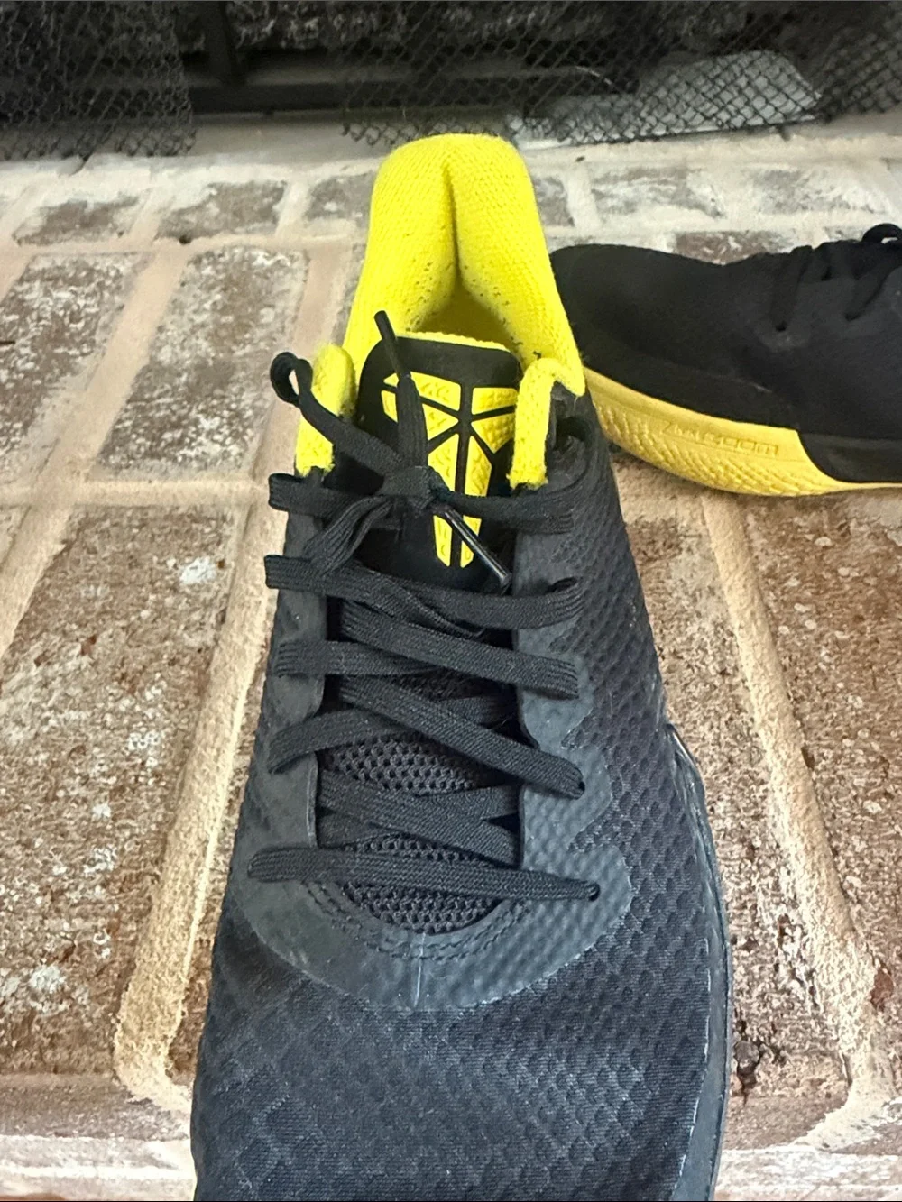 Nike Men’s Black Athletic Shoes with Yellow Lining